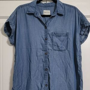 Woman's blue jeans shirt.